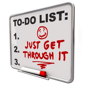 Just Get Through It message on a dry erase board encouraging you to stick with your project or challenge during a stressful time in your work or life